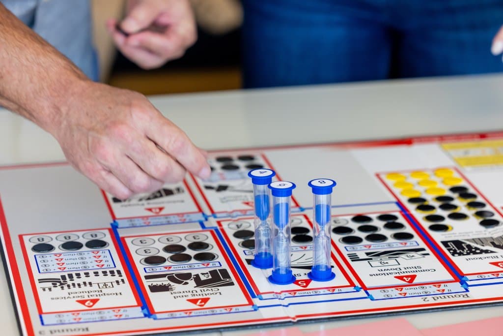 EMCE City Blackout game board showing the city map with power outage zones